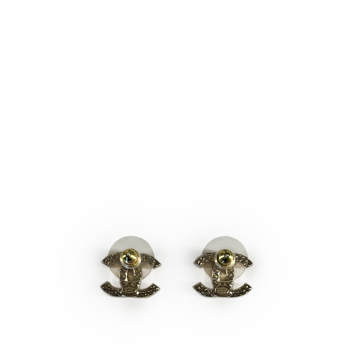 Chanel silver-tone interlocking CC logo stud earrings, curated Pre-loved Luxury by Myluxe in Helsinki.