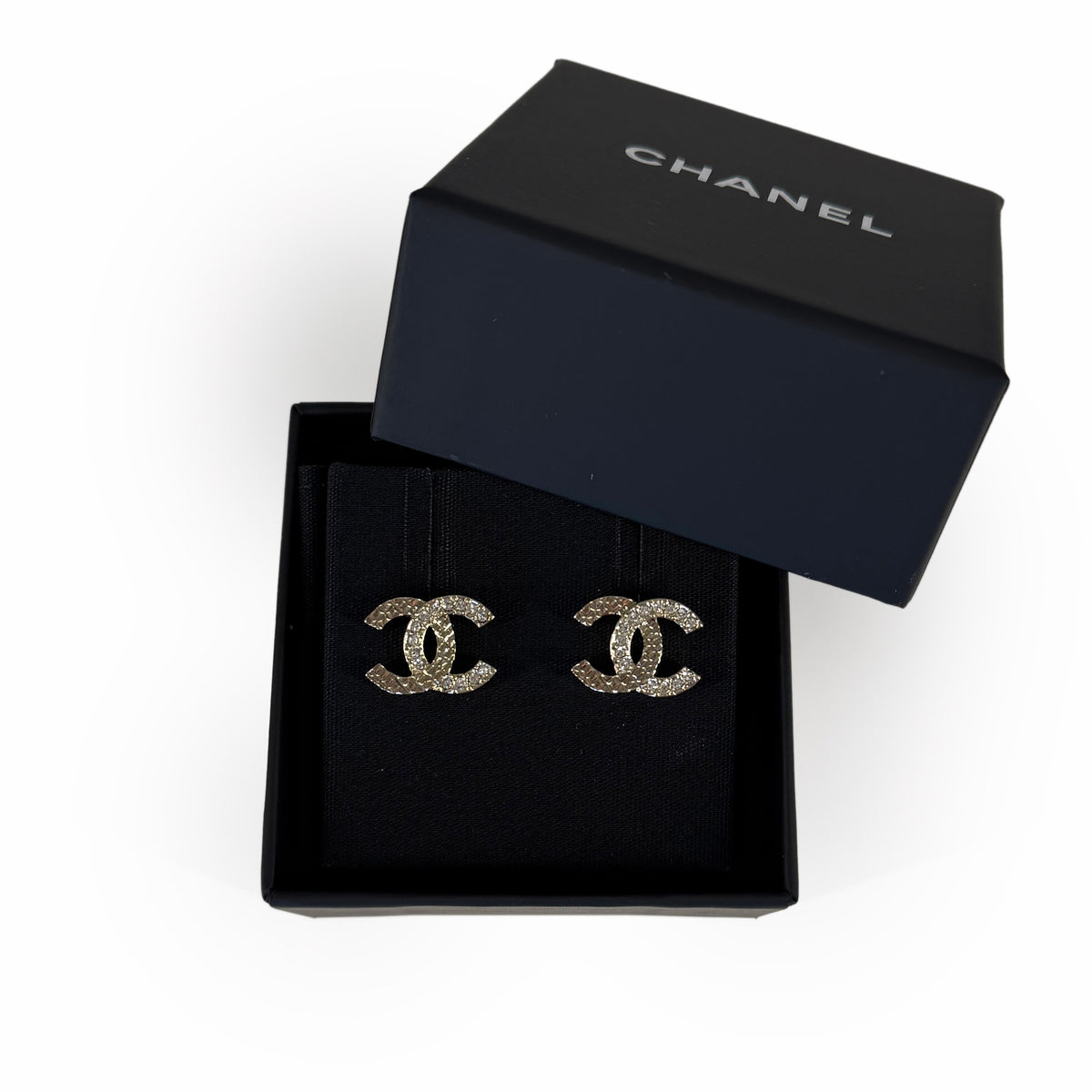 Chanel interlocking CC logo crystal stud earrings in a black gift box, curated Pre-loved Luxury by Myluxe in Helsinki.