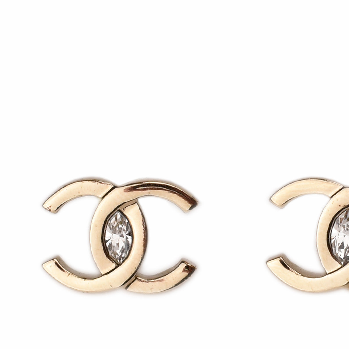 Gold-tone Chanel interlocking CC earrings with center diamonds, curated Pre-loved Luxury by Myluxe in Helsinki.
