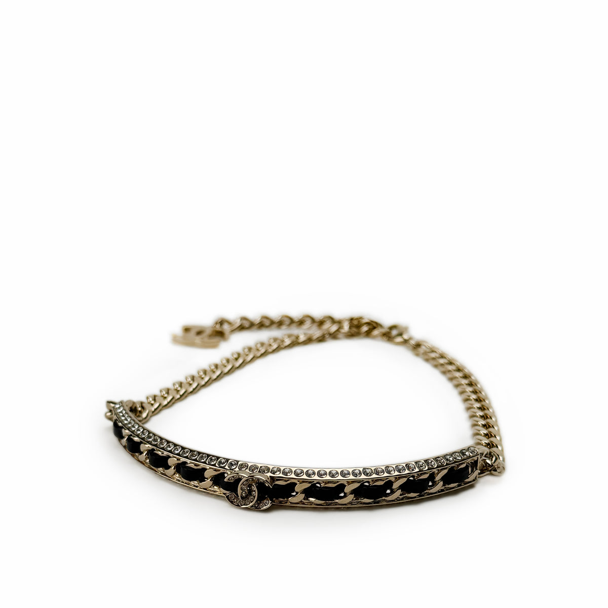 Gold-tone Chanel chain bracelet with black enamel and crystal embellishments, curated Pre-loved Luxury by Myluxe in Helsinki.