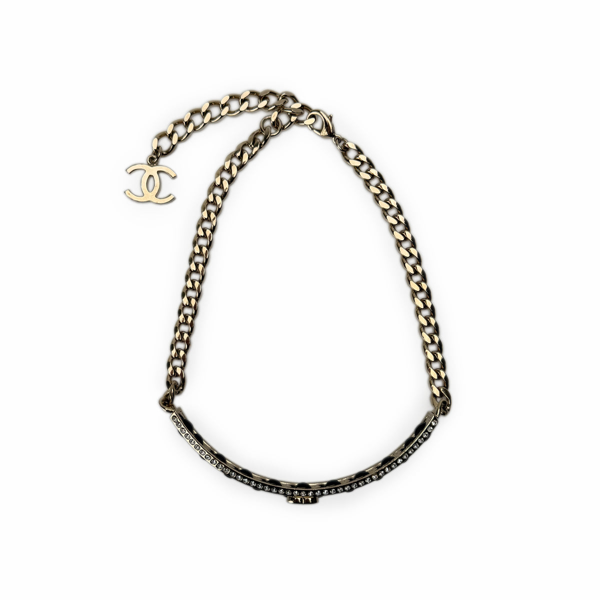 Gold-tone Chanel curb chain necklace with CC charm, curated Pre-loved Luxury by Myluxe in Helsinki.