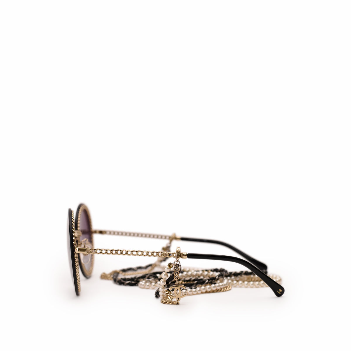 Round black sunglasses with gold chain detail and pearl accents, curated Pre-loved Luxury by Myluxe in Helsinki.