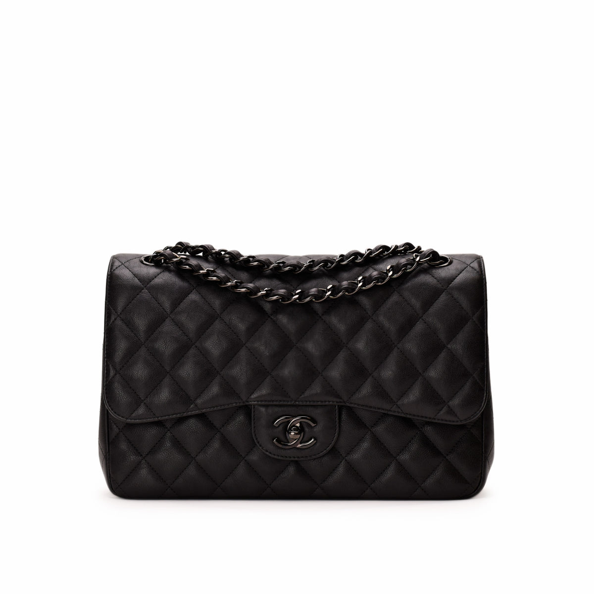 Chanel black quilted caviar leather flap bag with silver chain strap. curated Pre-loved Luxury by Myluxe in Helsinki.