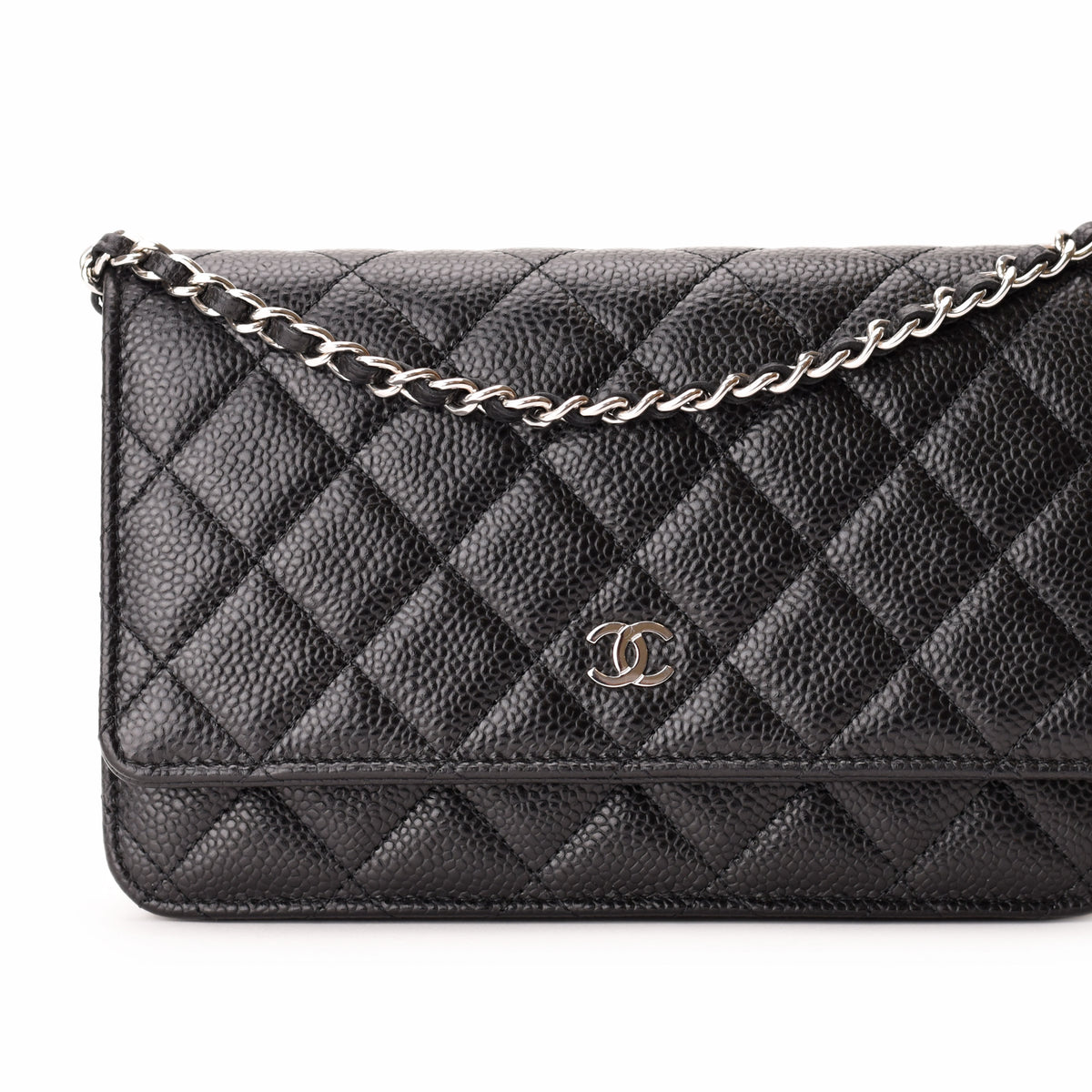Black caviar leather Chanel quilted handbag with silver chain and CC logo. curated Pre-loved Luxury by Myluxe in Helsinki.