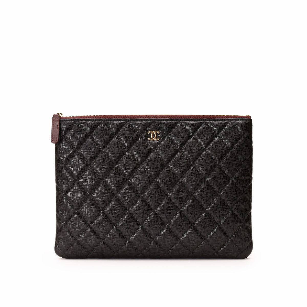 Black quilted leather Chanel pouch with gold CC logo. curated Pre-loved Luxury by Myluxe in Helsinki.