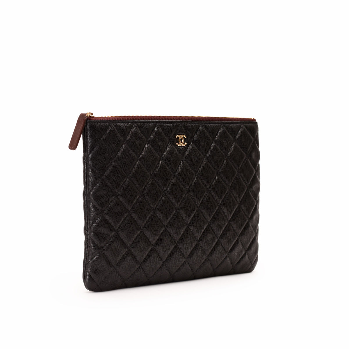 Black quilted leather Chanel clutch bag with gold-tone logo. curated Pre-loved Luxury by Myluxe in Helsinki.