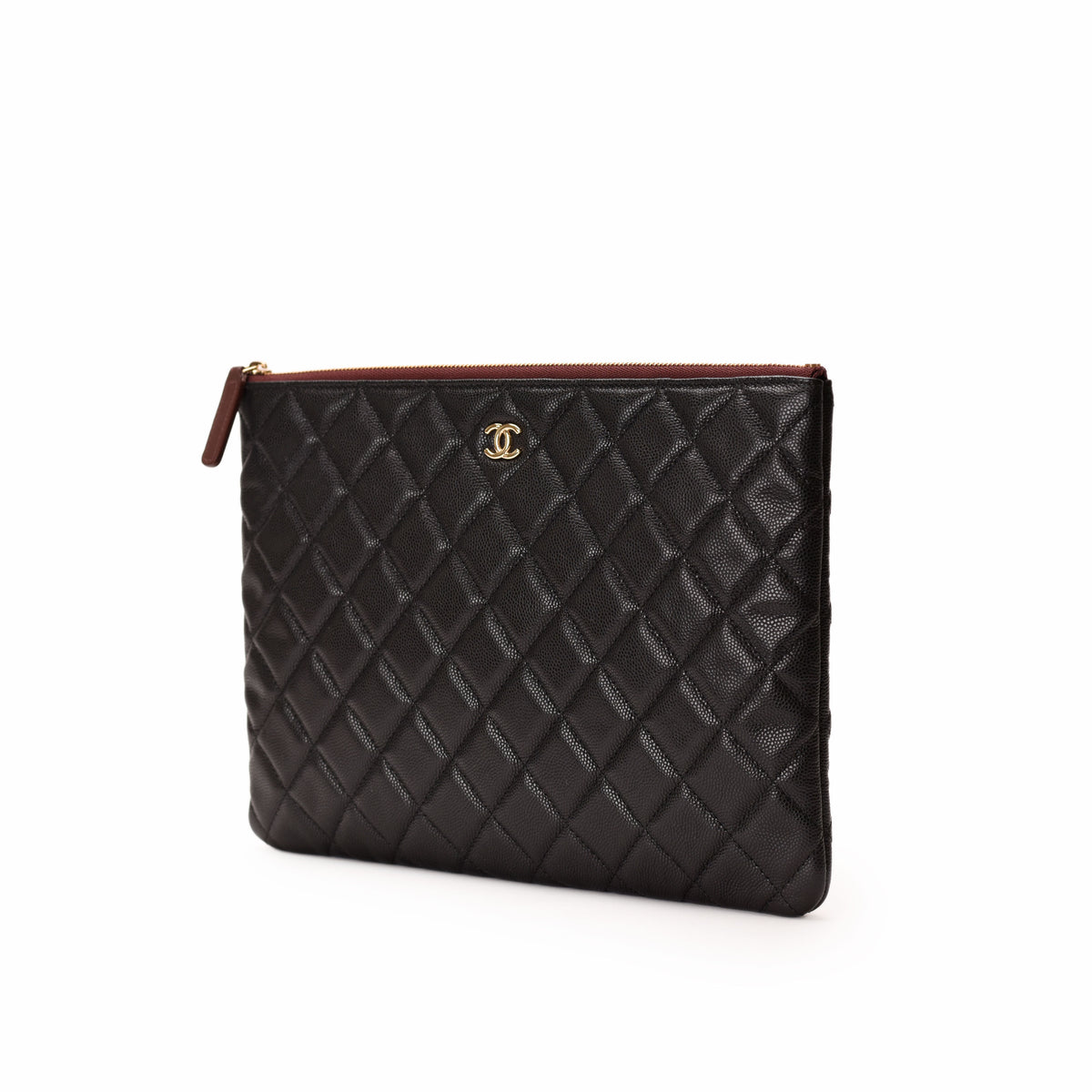 Chanel black quilted caviar leather clutch with gold CC logo. curated Pre-loved Luxury by Myluxe in Helsinki.
