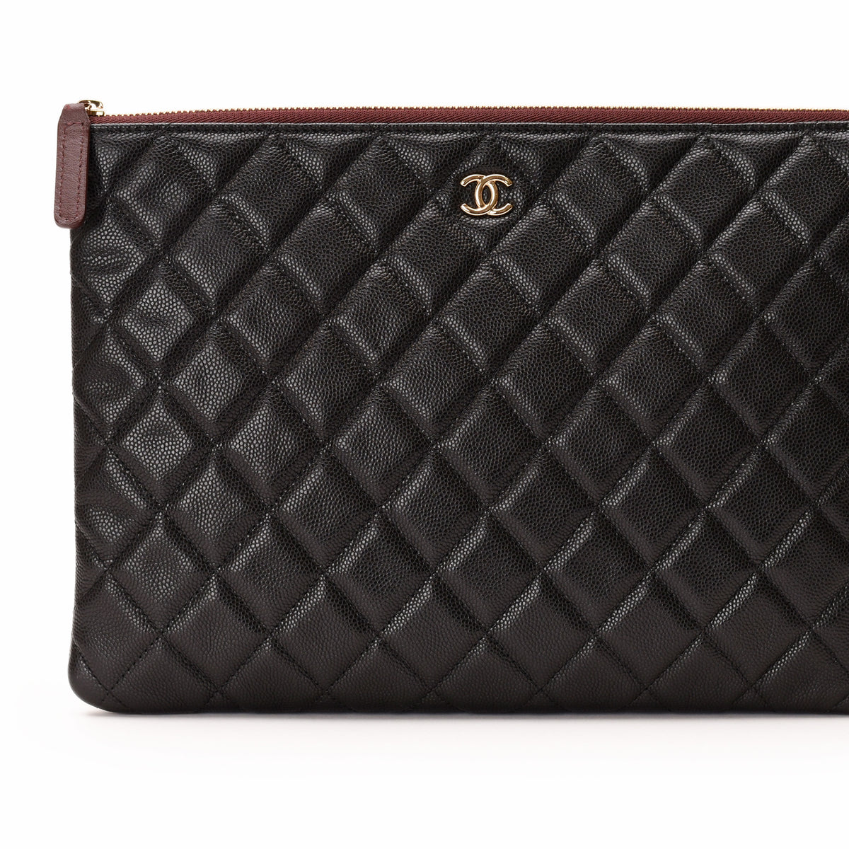 Black quilted caviar leather Chanel clutch with gold CC logo. curated Pre-loved Luxury by Myluxe in Helsinki.