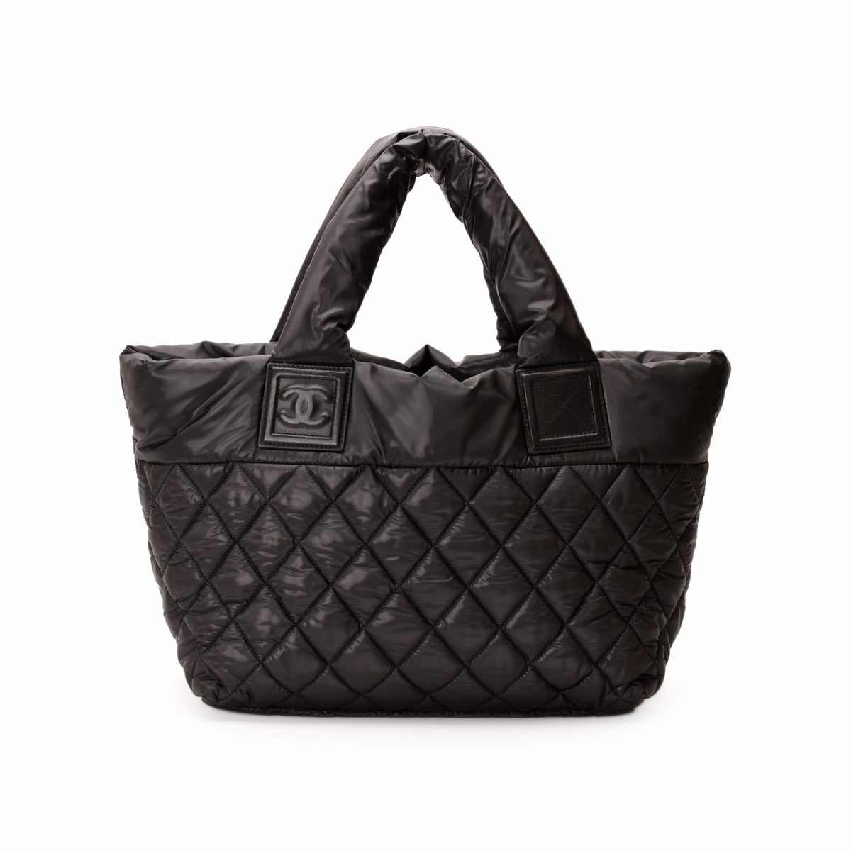 Black quilted nylon Chanel tote bag with top handles, curated Pre-loved Luxury by Myluxe in Helsinki.