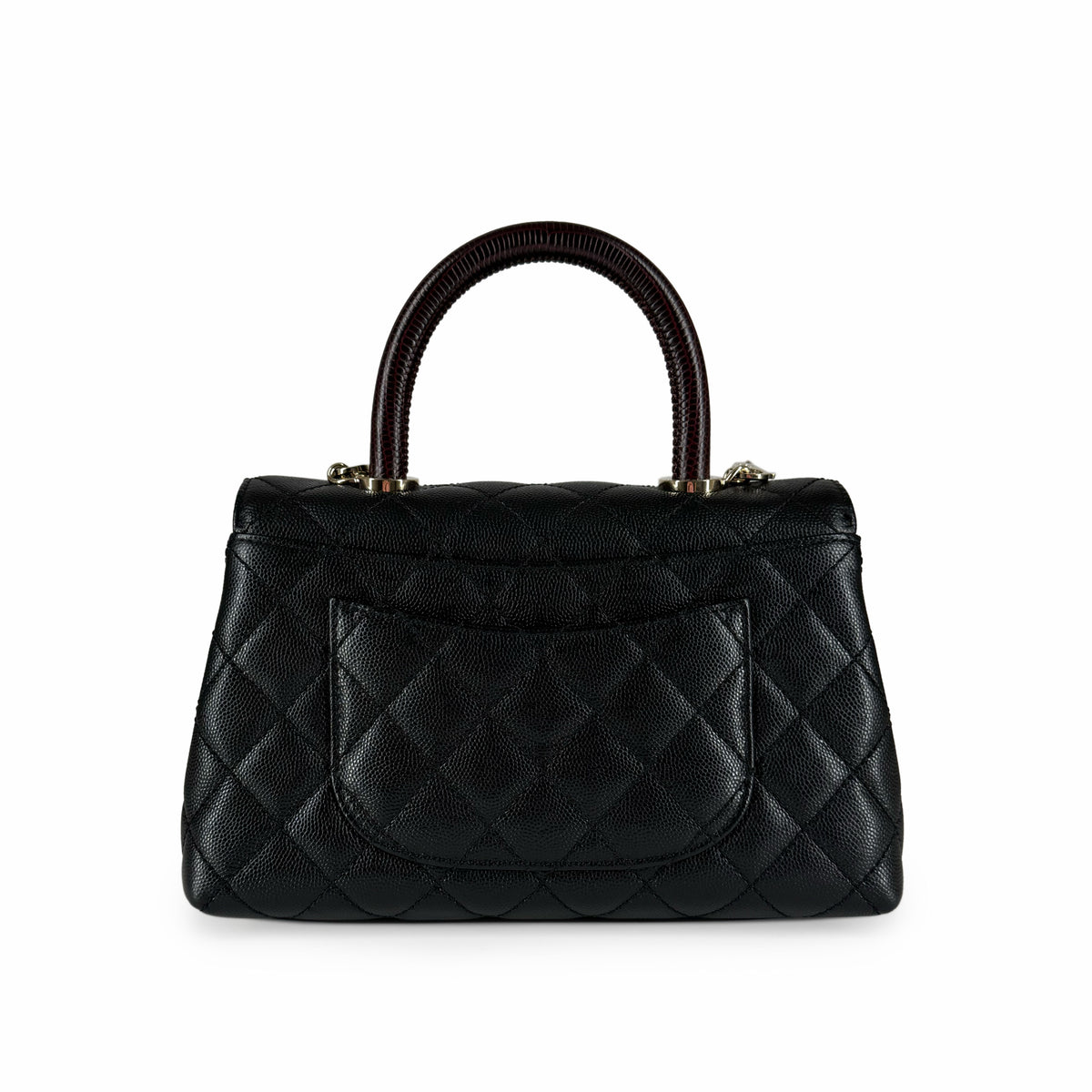 Black quilted leather handbag with a structured top handle, curated Pre-loved Luxury by Myluxe in Helsinki.