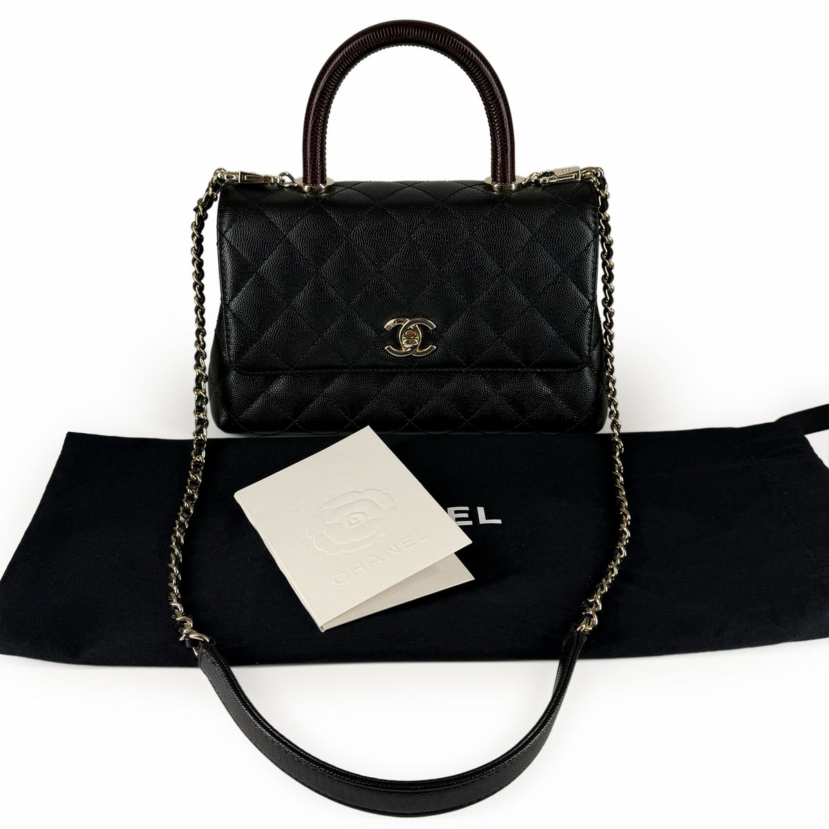Black quilted leather Chanel handbag with gold-tone hardware, curated Pre-loved Luxury by Myluxe in Helsinki.