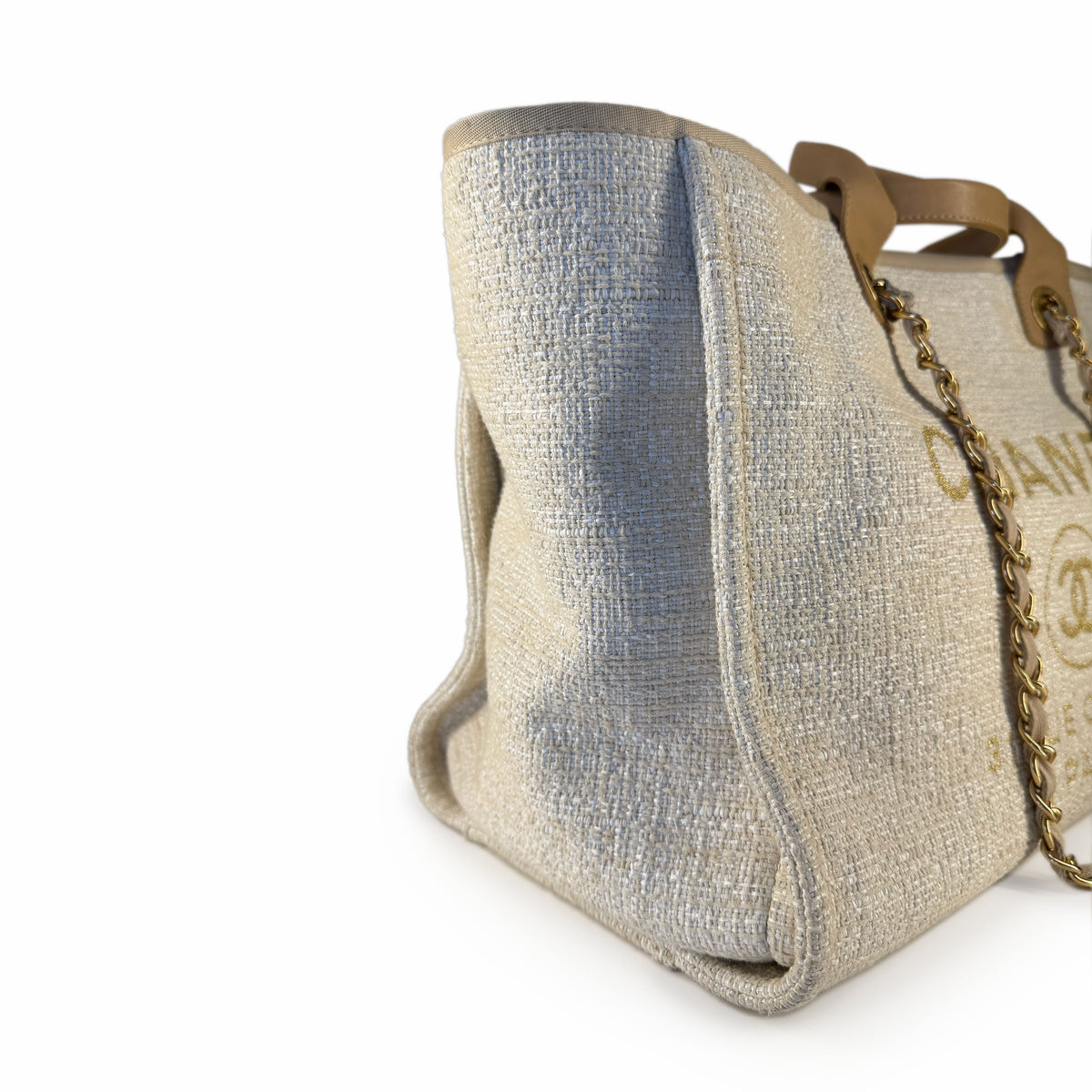 Tan canvas Chanel tote bag with leather handles and gold chain strap, curated Pre-loved Luxury by Myluxe in Helsinki.