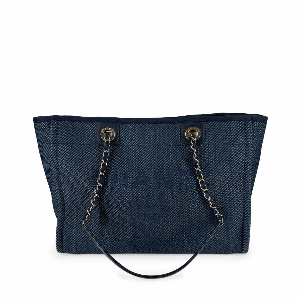 Navy blue denim Chanel tote bag with silver chain straps, curated Pre-loved Luxury by Myluxe in Helsinki.