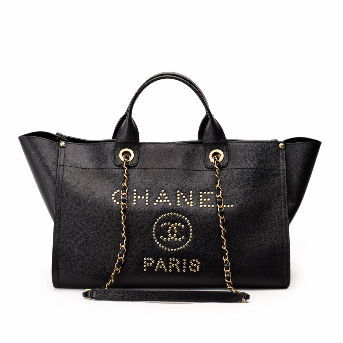 Black leather Chanel tote bag with gold-tone studded logo, curated Pre-loved Luxury by Myluxe in Helsinki.