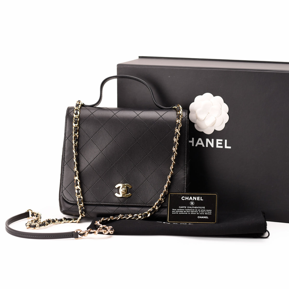 Black quilted leather Chanel handbag with gold-tone chain strap, curated Pre-loved Luxury by Myluxe in Helsinki.