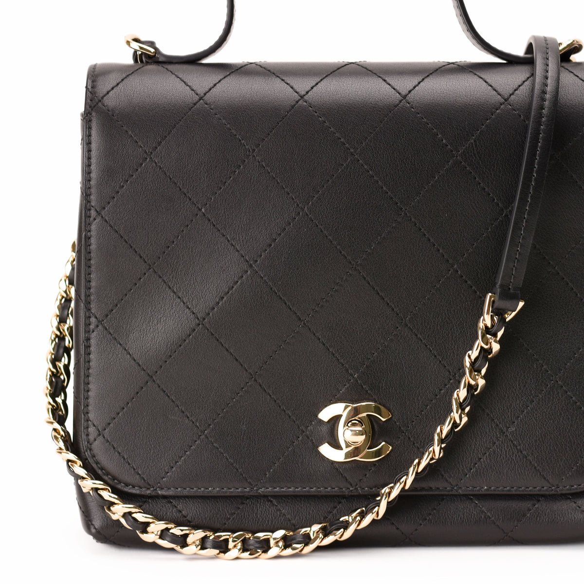 Black quilted leather Chanel flap bag with gold-tone chain strap, curated Pre-loved Luxury by Myluxe in Helsinki.