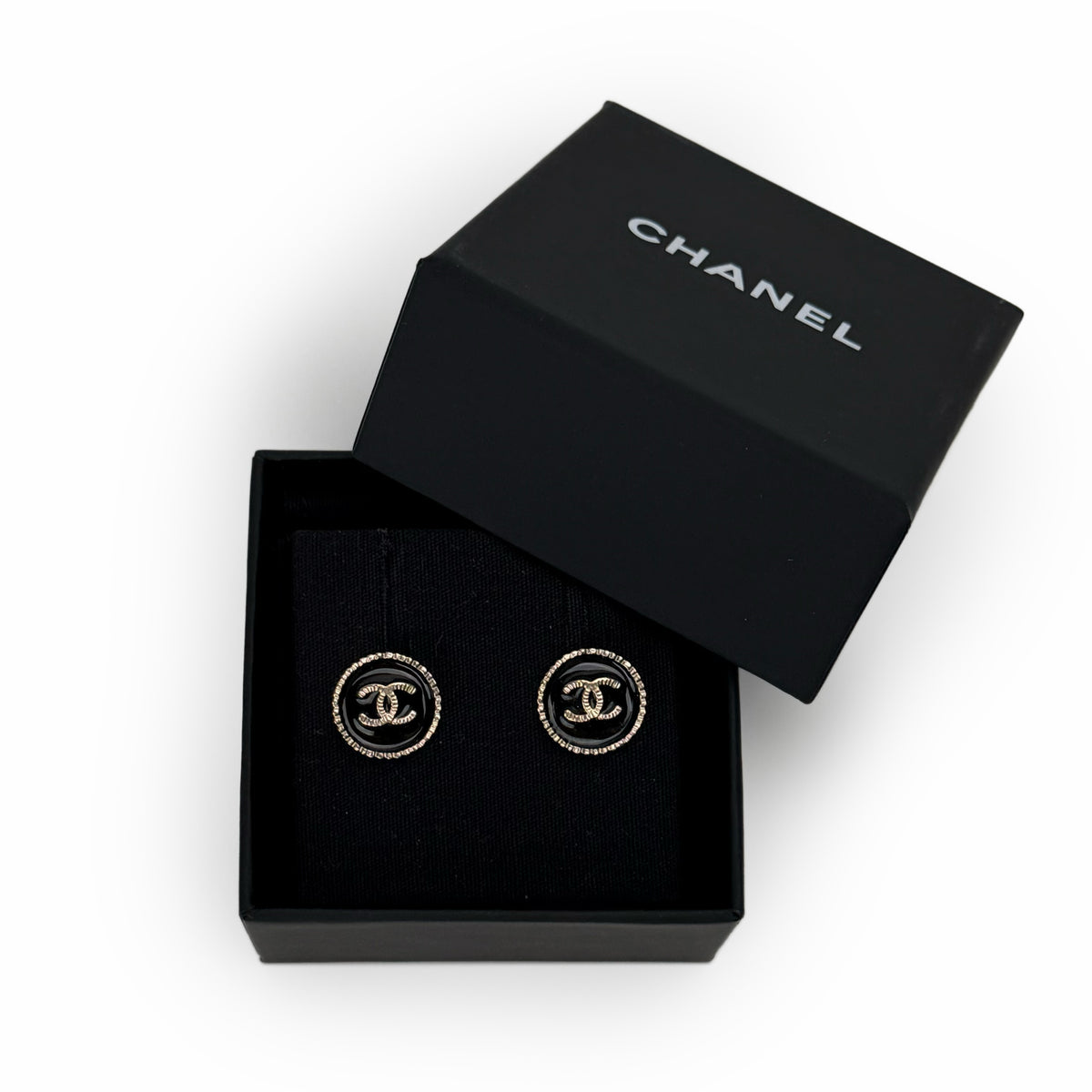 Chanel black enamel and gold-tone CC logo stud earrings, curated Pre-loved Luxury by Myluxe in Helsinki.