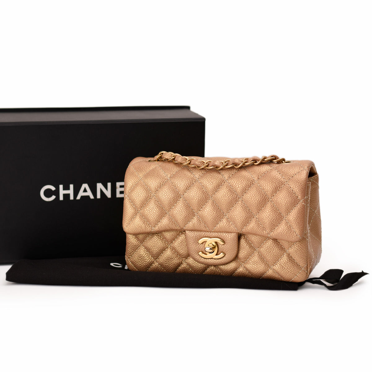 Gold quilted leather Chanel handbag with gold chain strap, curated Pre-loved Luxury by Myluxe in Helsinki.
