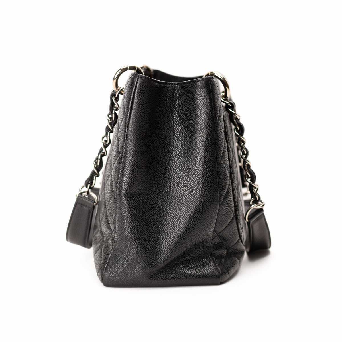 Black quilted caviar leather Chanel bucket bag with silver chain strap. curated Pre-loved Luxury by Myluxe in Helsinki.