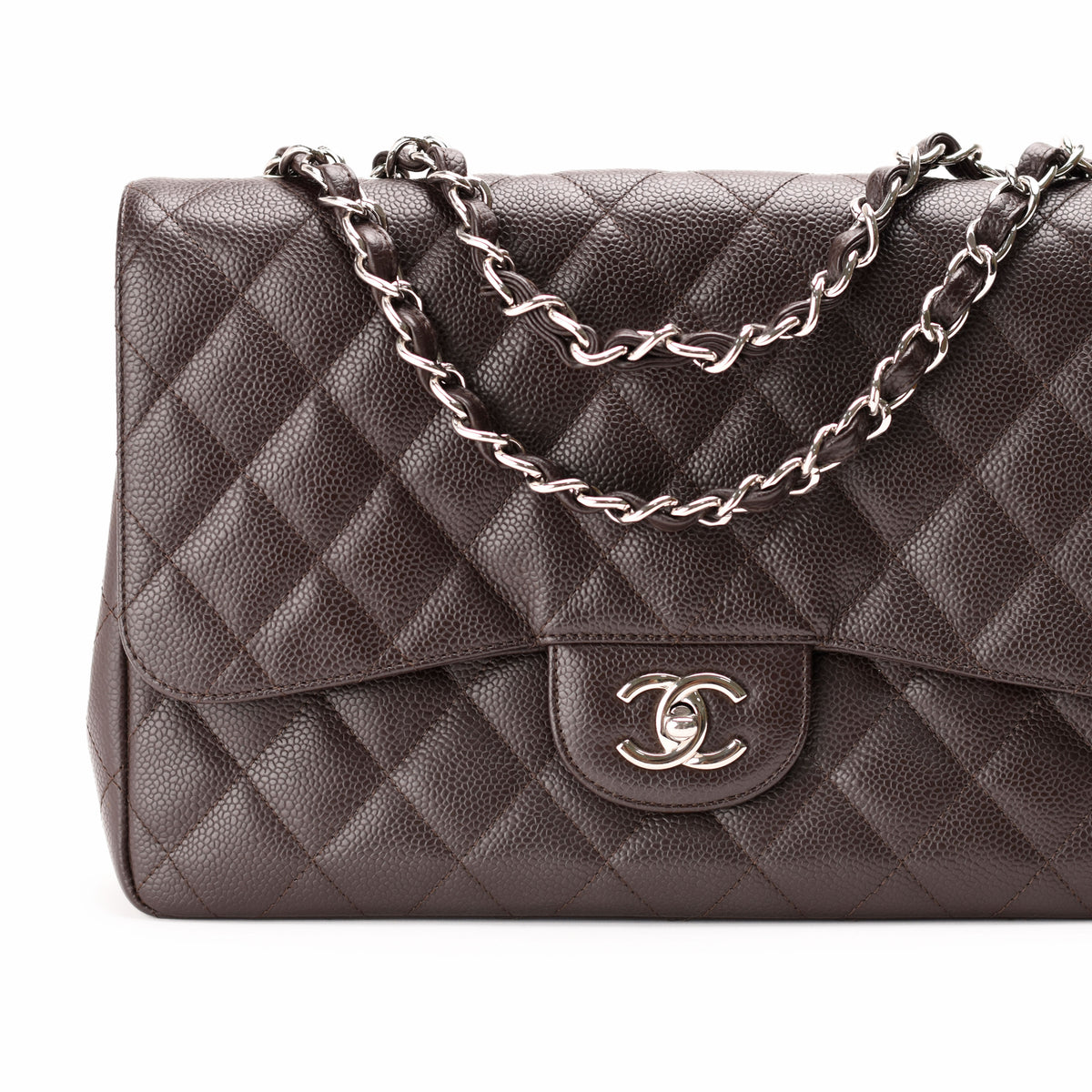 Brown quilted caviar leather Chanel flap bag with silver chain strap, curated Pre-loved Luxury by Myluxe in Helsinki.