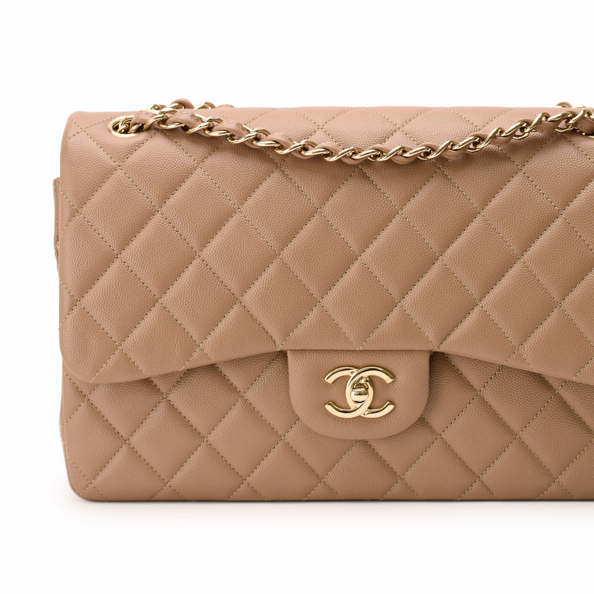 Beige quilted lambskin Chanel flap bag with gold chain and CC hardware, curated Pre-loved Luxury by Myluxe in Helsinki.