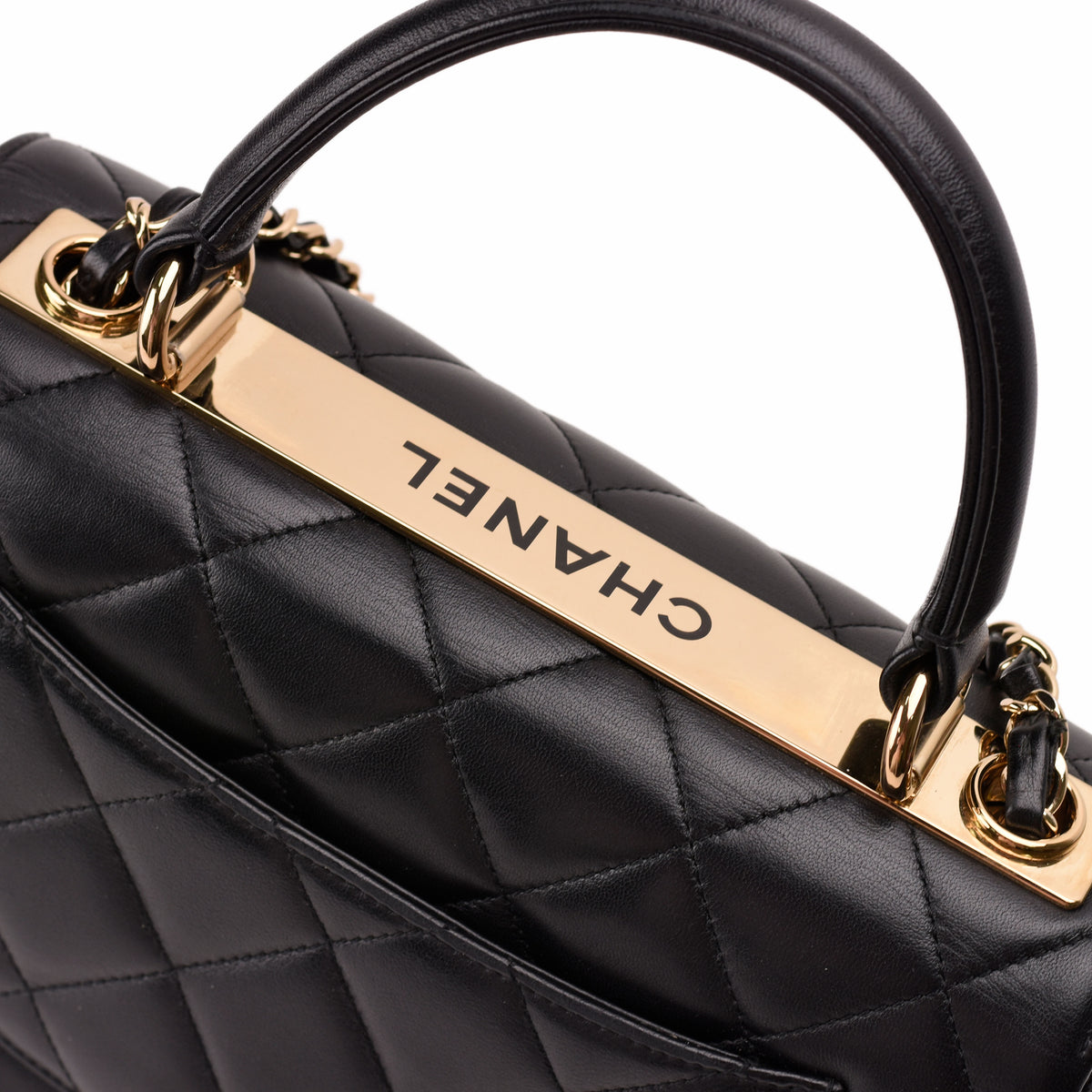 Close-up of a black quilted leather Chanel handbag with gold-tone hardware, curated Pre-loved Luxury by Myluxe in Helsinki.