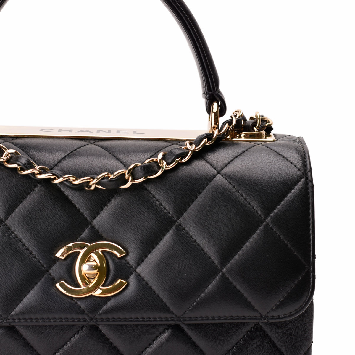 Black quilted leather Chanel handbag with gold-tone CC logo and chain strap, curated Pre-loved Luxury by Myluxe in Helsinki.