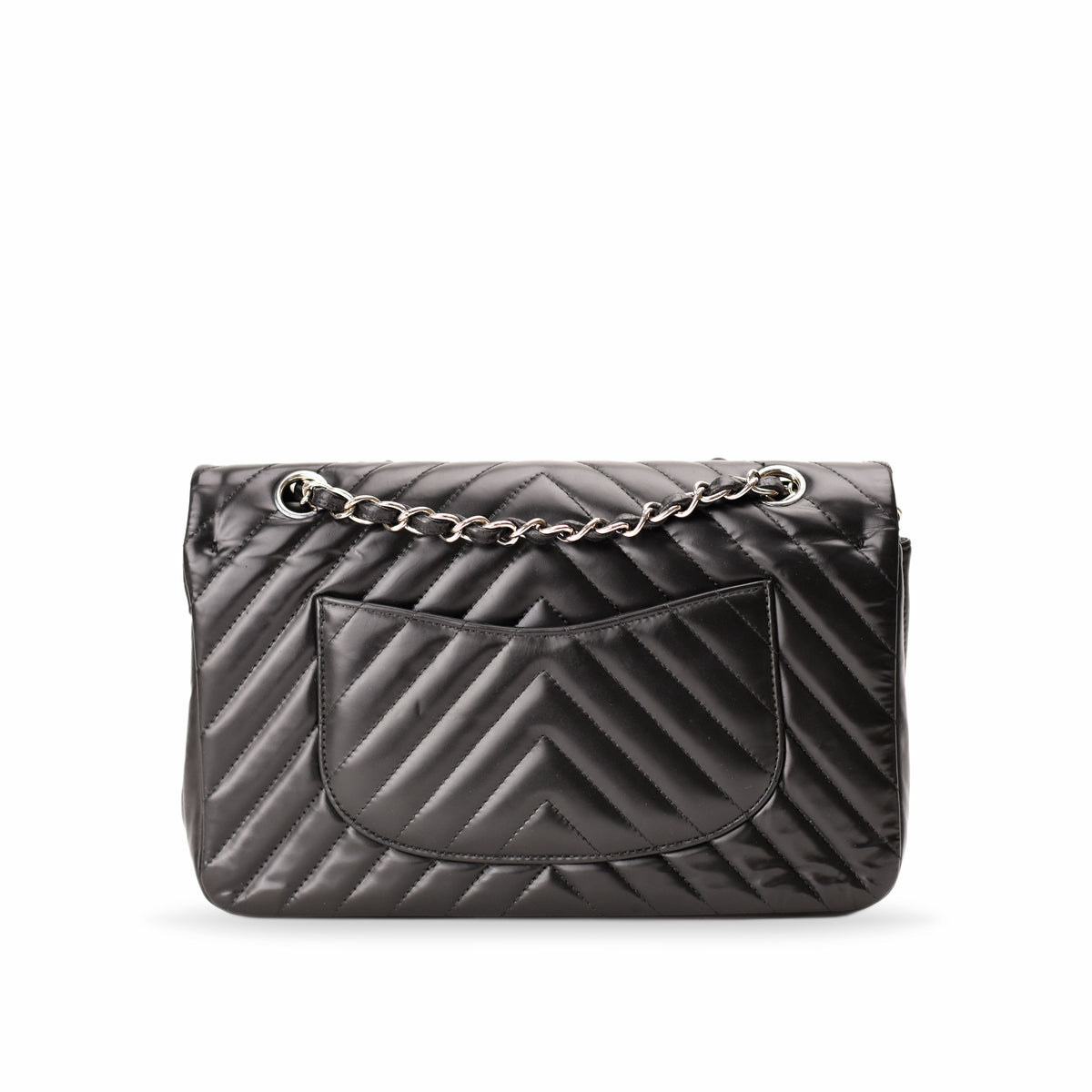 Black quilted leather Chanel flap bag with silver chain strap. curated Pre-loved Luxury by Myluxe in Helsinki.