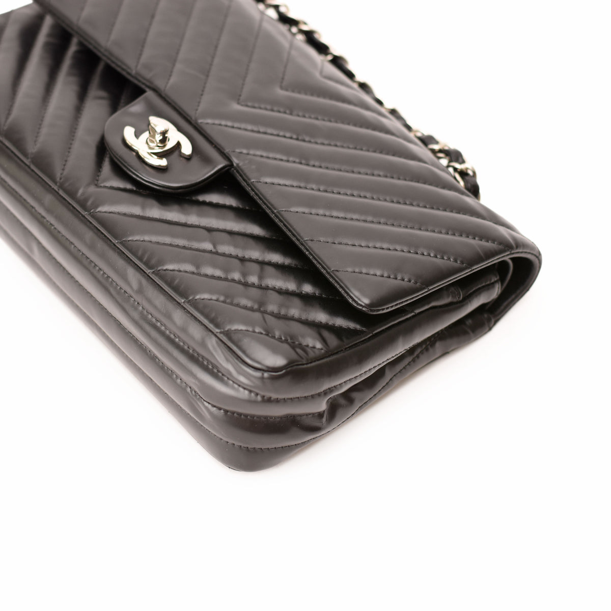 Black quilted leather Chanel flap bag with silver CC logo. curated Pre-loved Luxury by Myluxe in Helsinki.