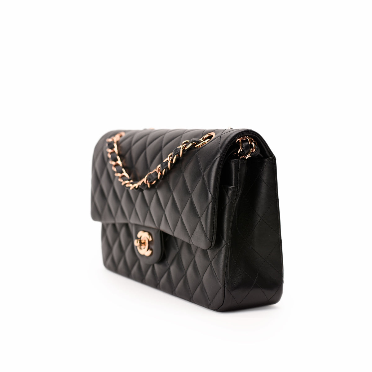 Black quilted lambskin Chanel flap bag with rose-gold-tone chain strap, curated Pre-loved Luxury by Myluxe in Helsinki.