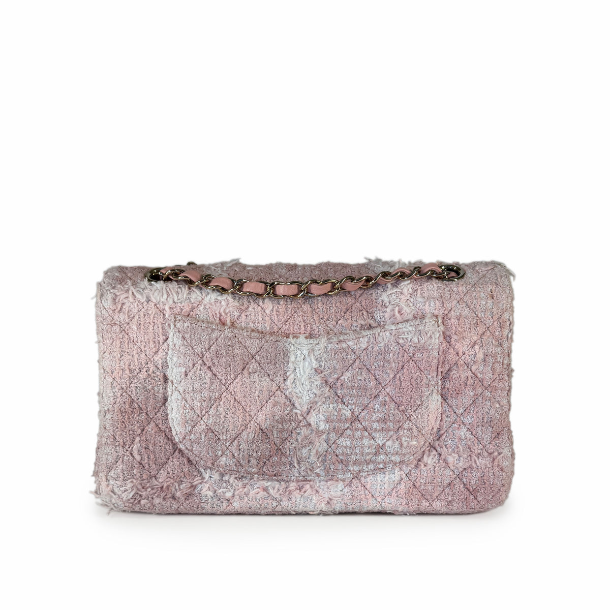 Pink quilted distressed fabric handbag with a gold chain strap, curated Pre-loved Luxury by Myluxe in Helsinki.
