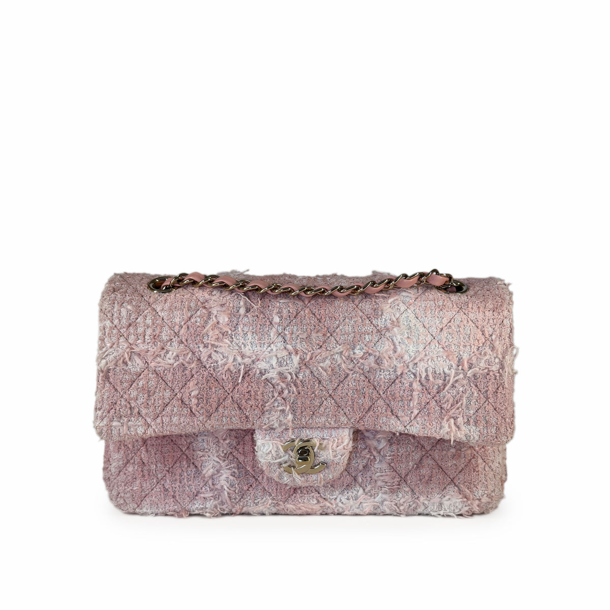 Pink distressed tweed Chanel flap bag with gold chain strap, curated Pre-loved Luxury by Myluxe in Helsinki.