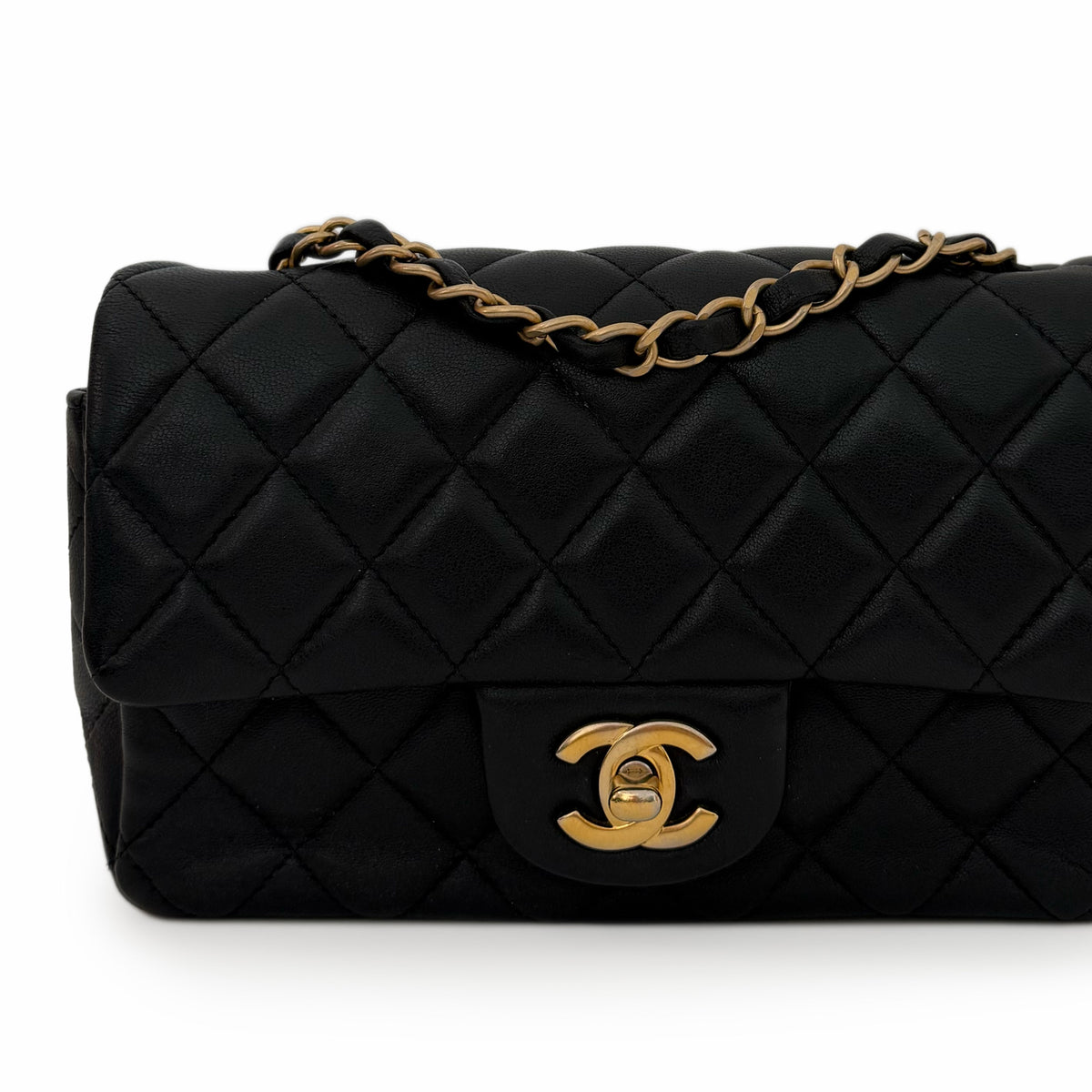 Black quilted lambskin Chanel flap bag with gold-tone hardware, curated Pre-loved Luxury by Myluxe in Helsinki.
