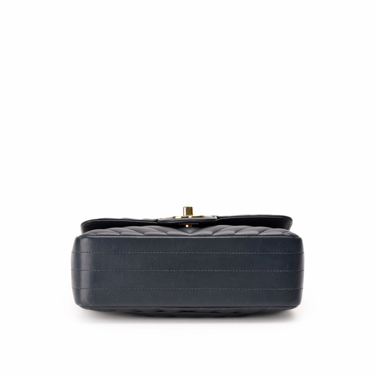 Black quilted leather clutch with gold-tone hardware, curated Pre-loved Luxury by Myluxe in Helsinki.