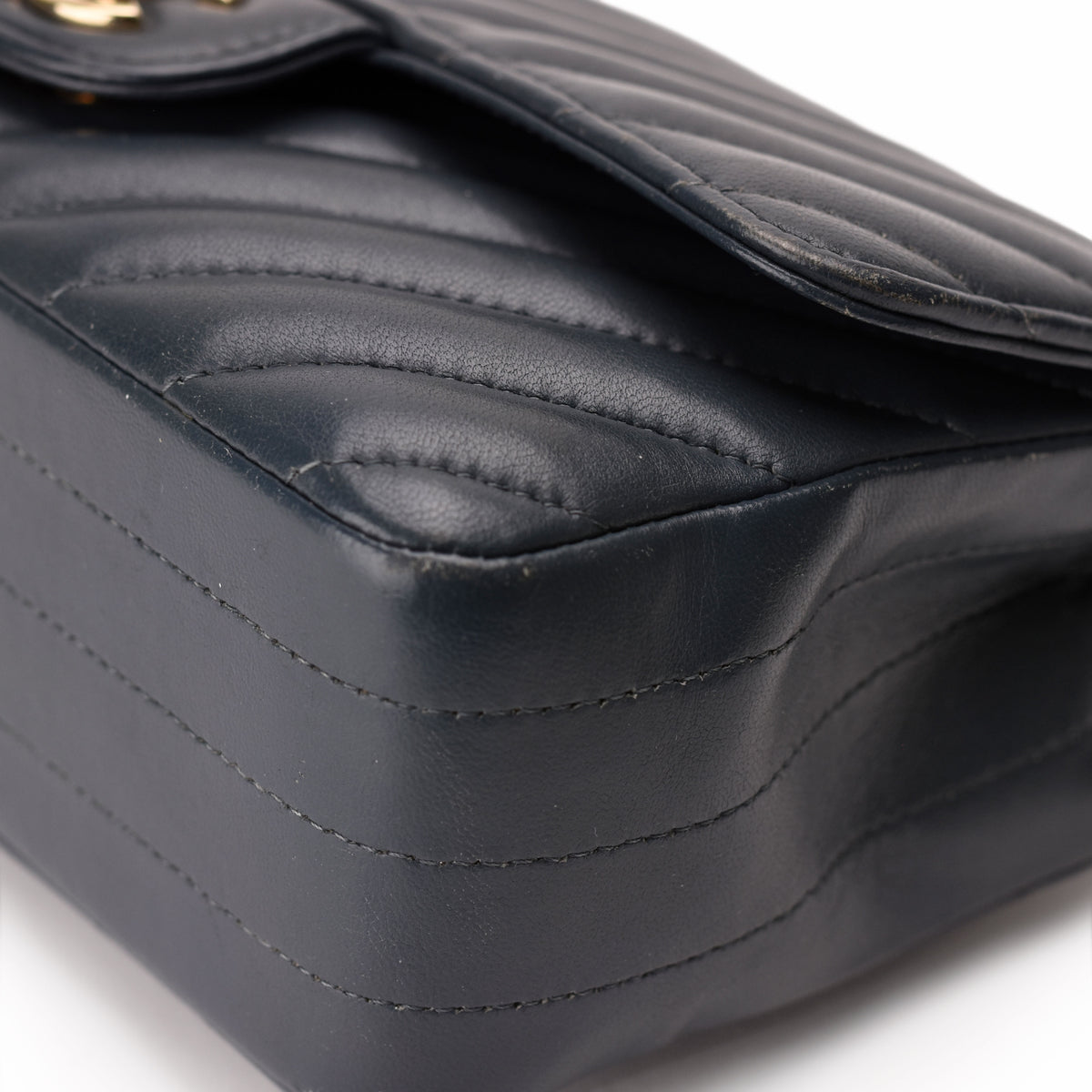 Black quilted leather designer handbag with elegant stitching, curated Pre-loved Luxury by Myluxe in Helsinki.