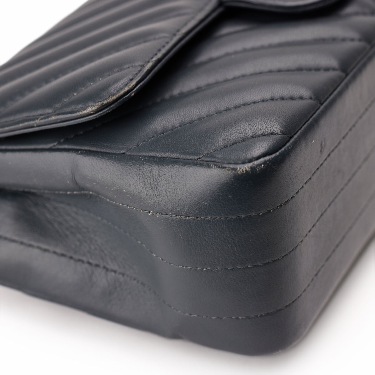 Black quilted leather designer handbag with textured finish, curated Pre-loved Luxury by Myluxe in Helsinki.