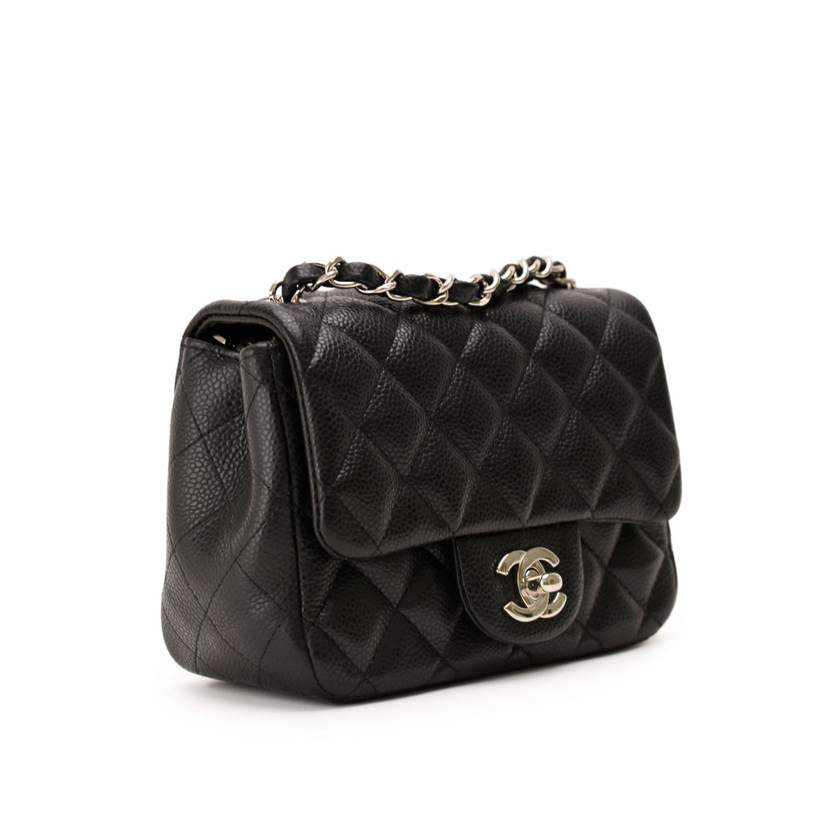 Black quilted leather Chanel flap bag with silver chain strap, curated Pre-loved Luxury by Myluxe in Helsinki.