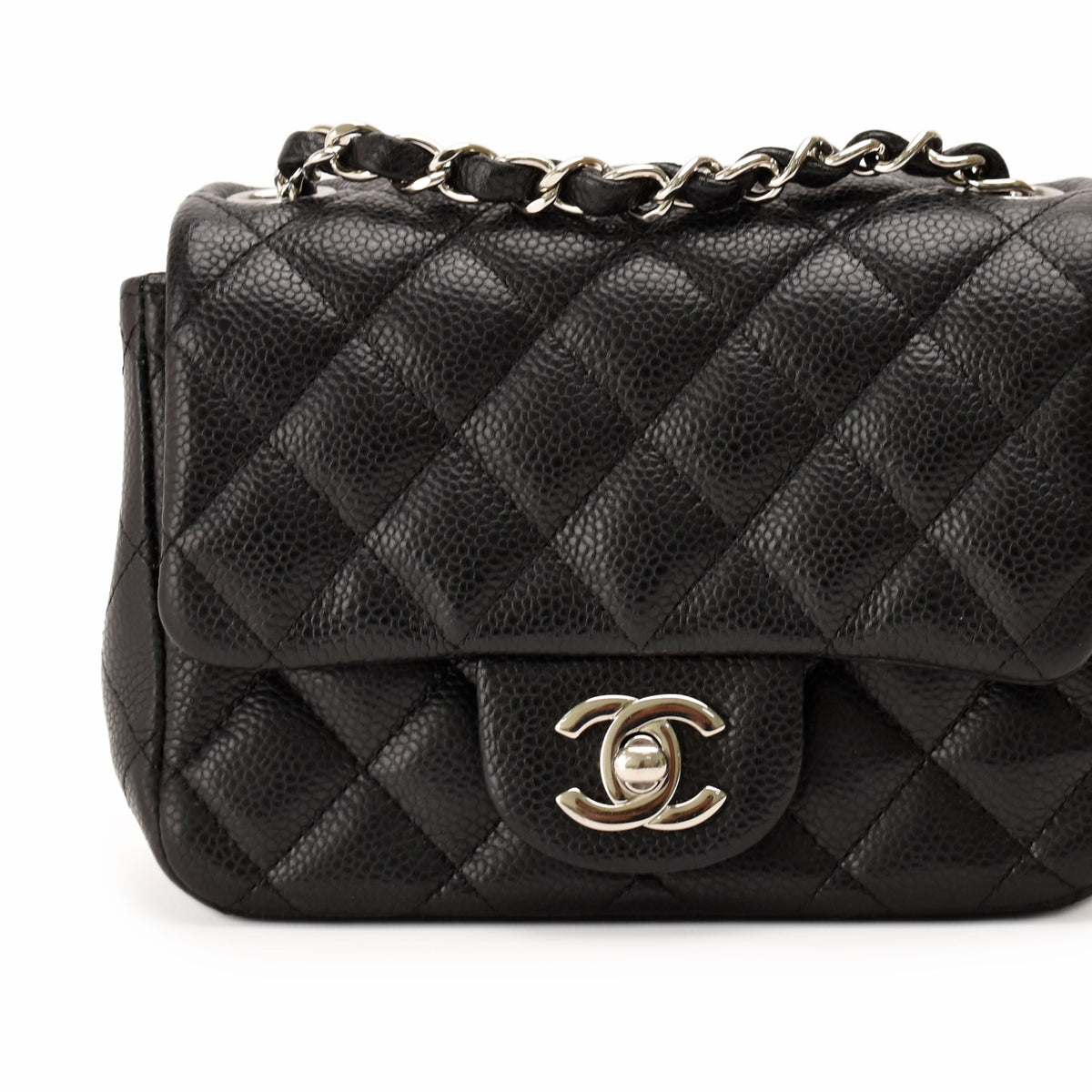 Black quilted caviar leather handbag with silver chain strap and CC logo, curated Pre-loved Luxury by Myluxe in Helsinki.