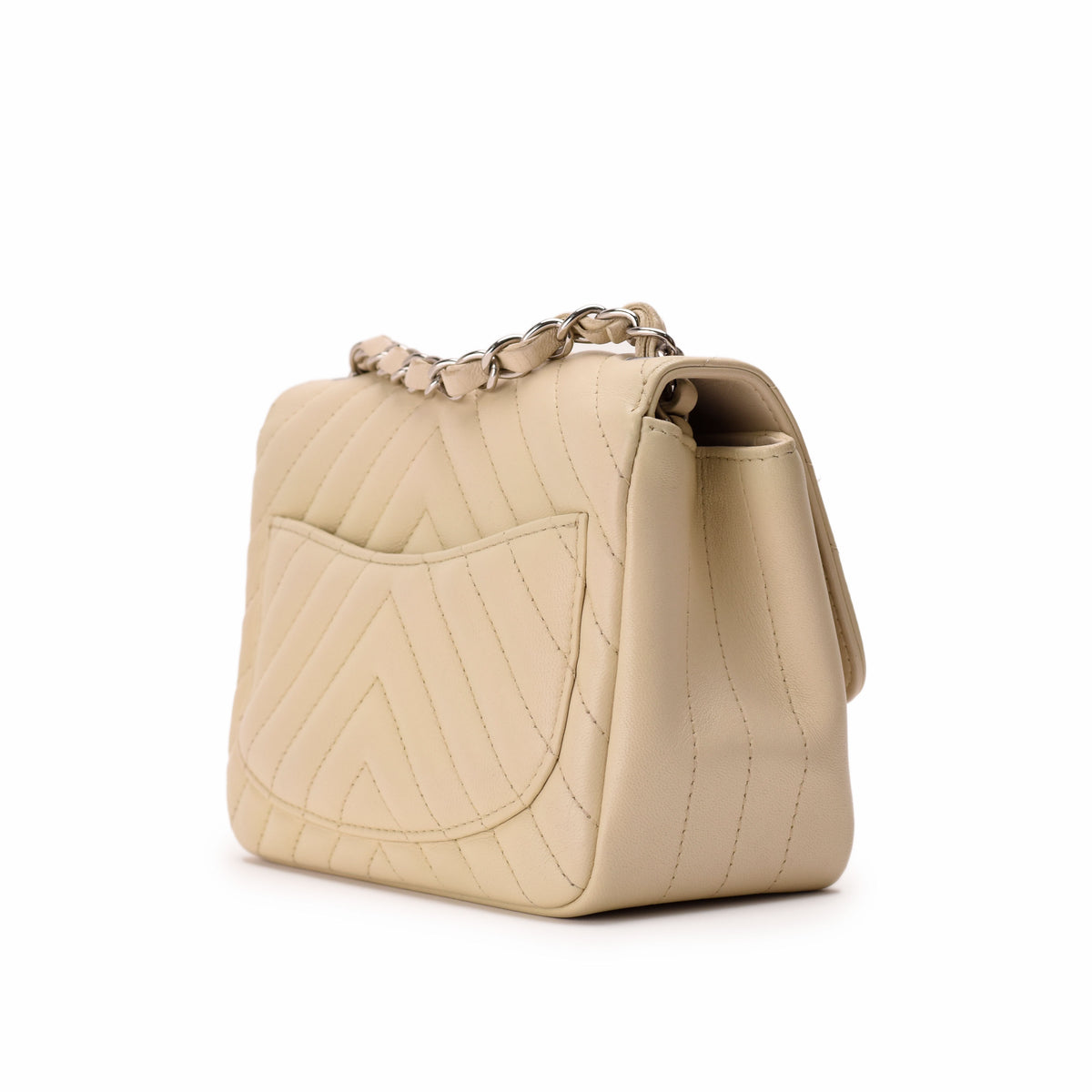 Beige quilted leather handbag with silver chain strap, curated Pre-loved Luxury by Myluxe in Helsinki.