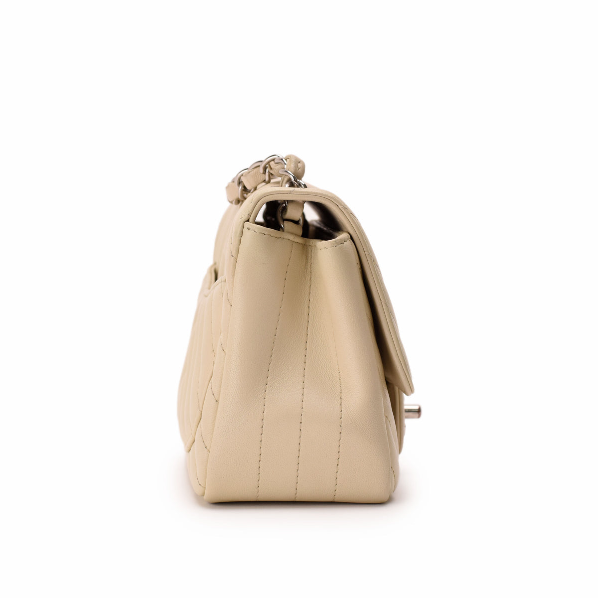 Cream quilted leather handbag with silver chain strap, curated Pre-loved Luxury by Myluxe in Helsinki.