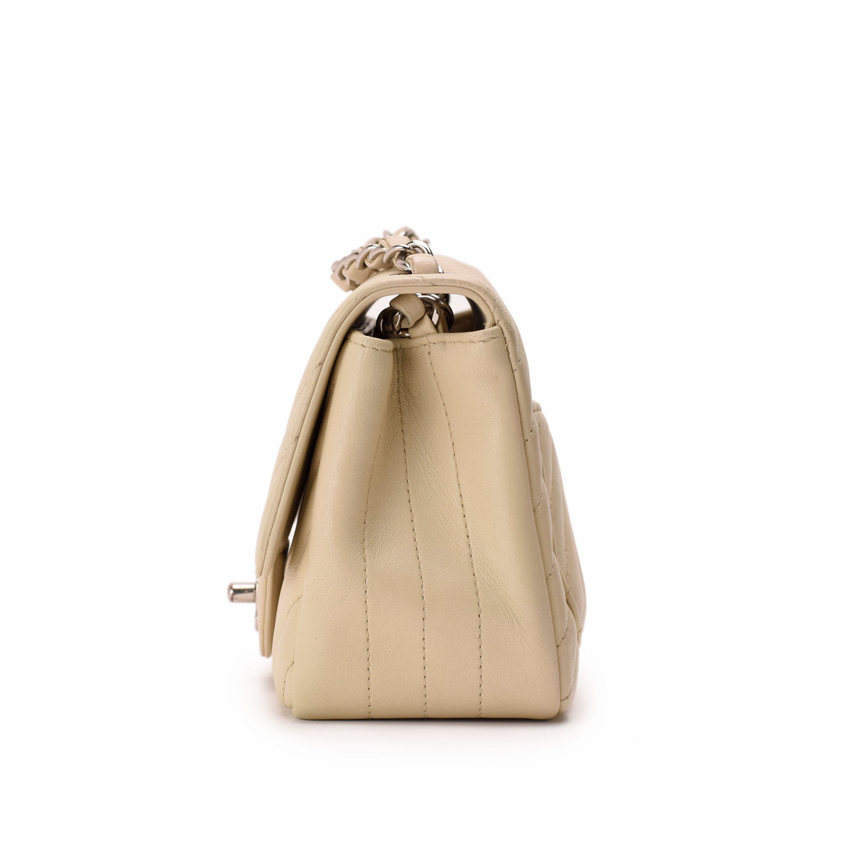 Beige quilted leather handbag with silver chain strap, curated Pre-loved Luxury by Myluxe in Helsinki.