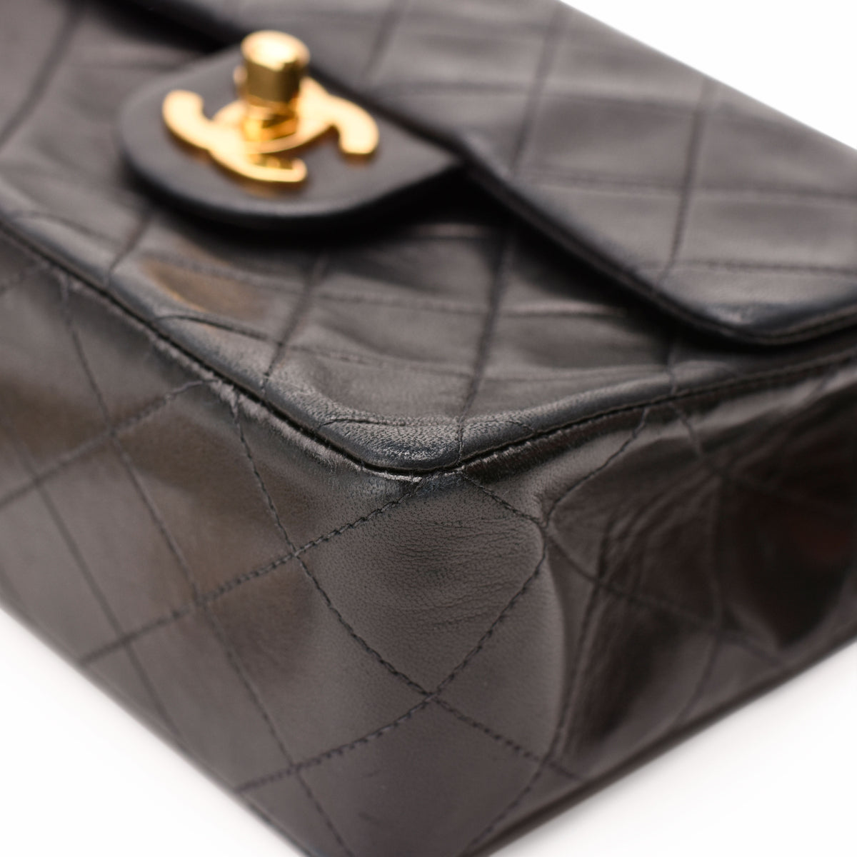 Black quilted lambskin leather Chanel flap bag with gold-tone hardware, curated Pre-loved Luxury by Myluxe in Helsinki.