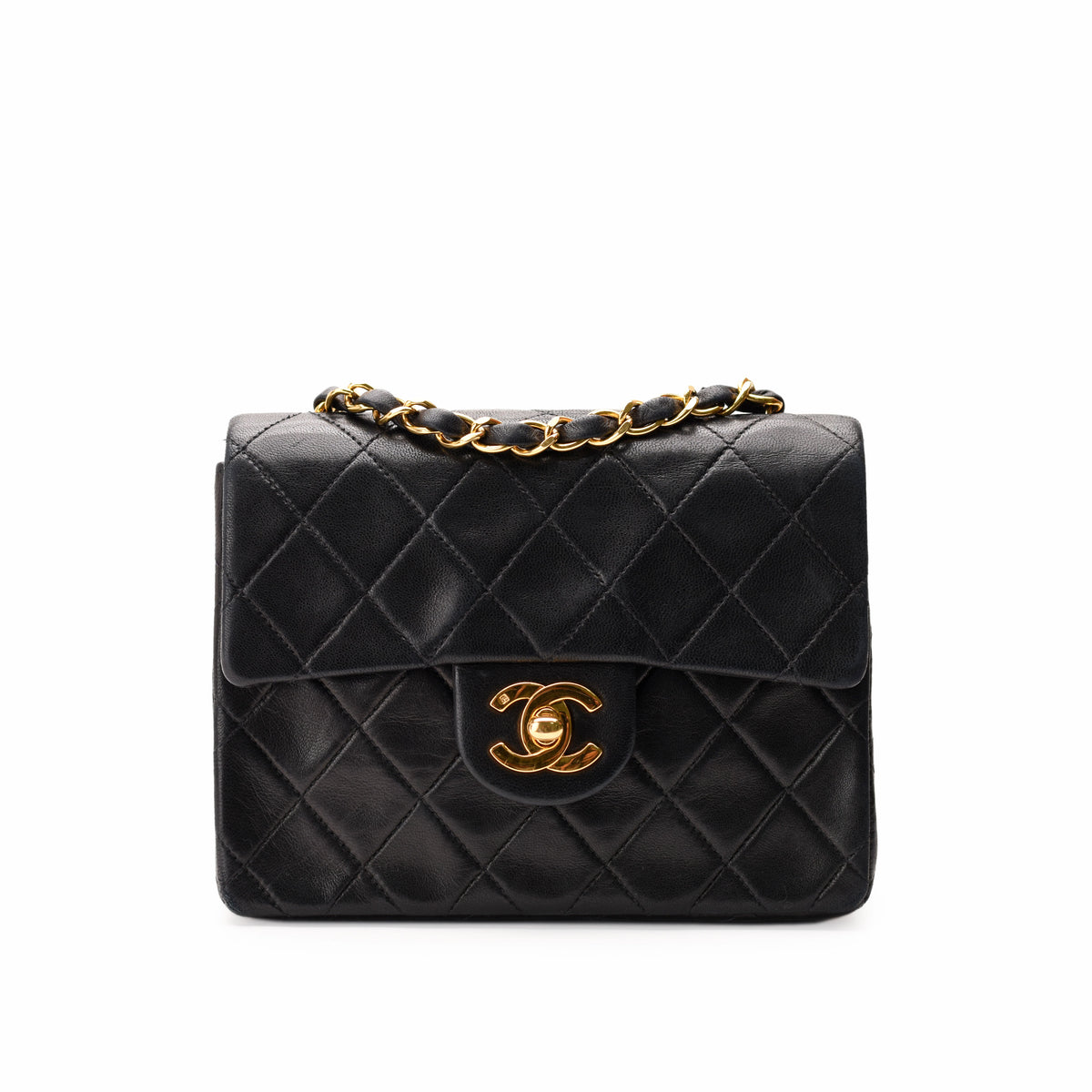 Black quilted lambskin Chanel flap bag with gold-tone chain and CC hardware, curated Pre-loved Luxury by Myluxe in Helsinki.