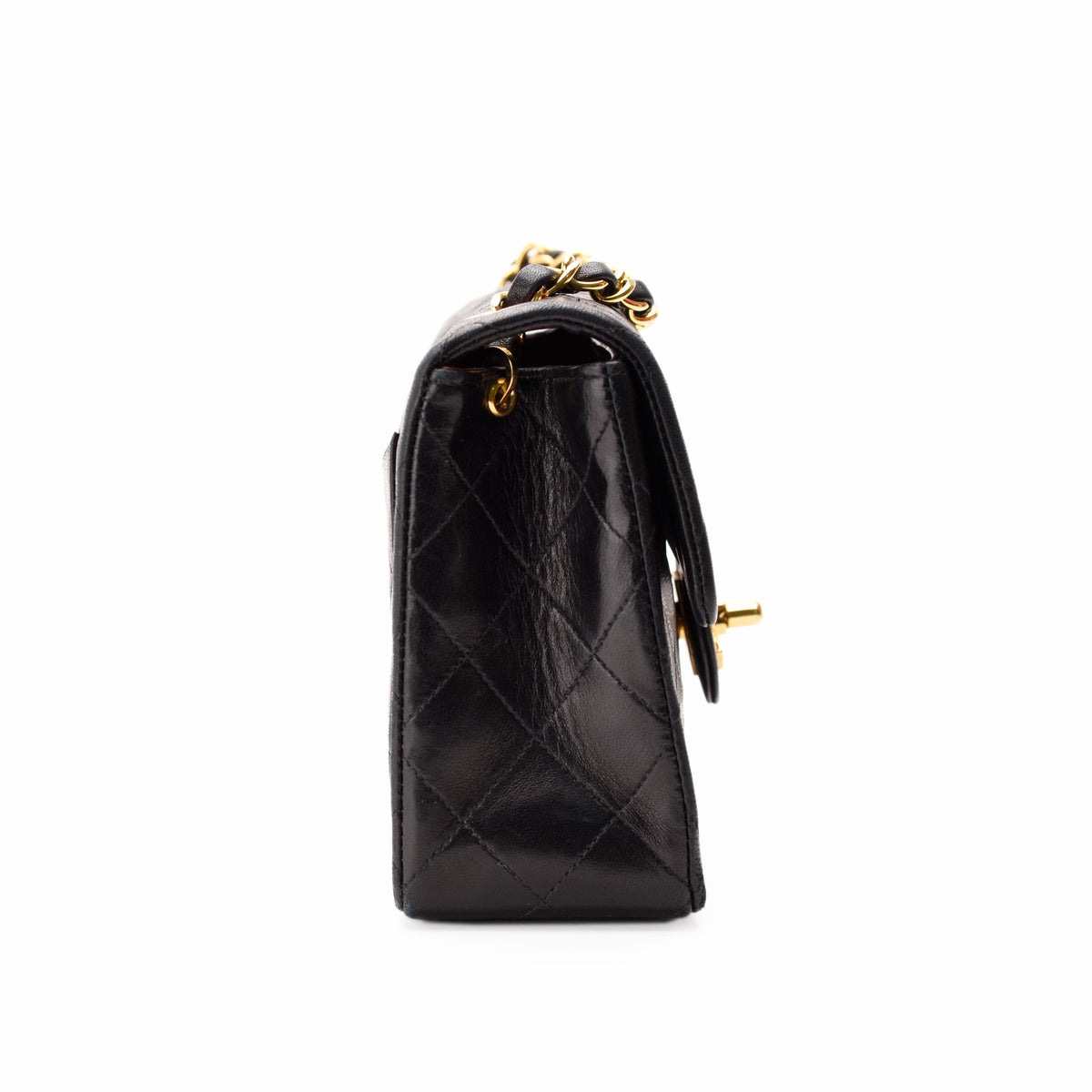 Black quilted lambskin leather handbag with gold-tone chain strap, curated Pre-loved Luxury by Myluxe in Helsinki.