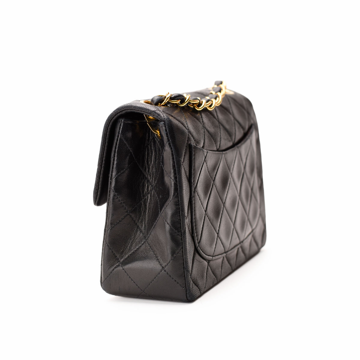 Black quilted leather handbag with gold-tone chain strap, curated Pre-loved Luxury by Myluxe in Helsinki.