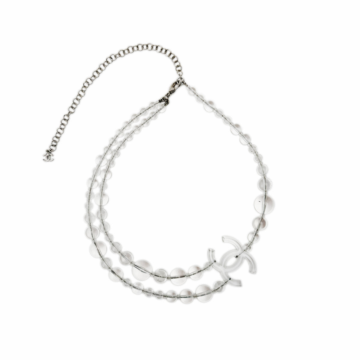 Transparent bead necklace with silver-tone CC logo charm, curated Pre-loved Luxury by Myluxe in Helsinki.