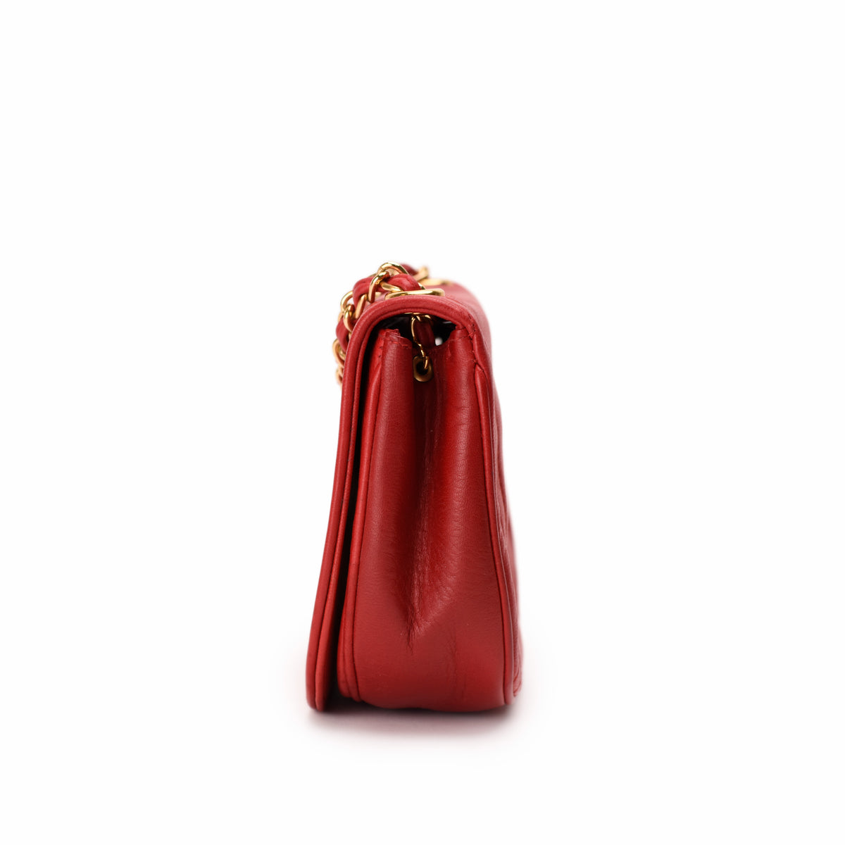 Red leather handbag with gold chain strap, curated Pre-loved Luxury by Myluxe in Helsinki.