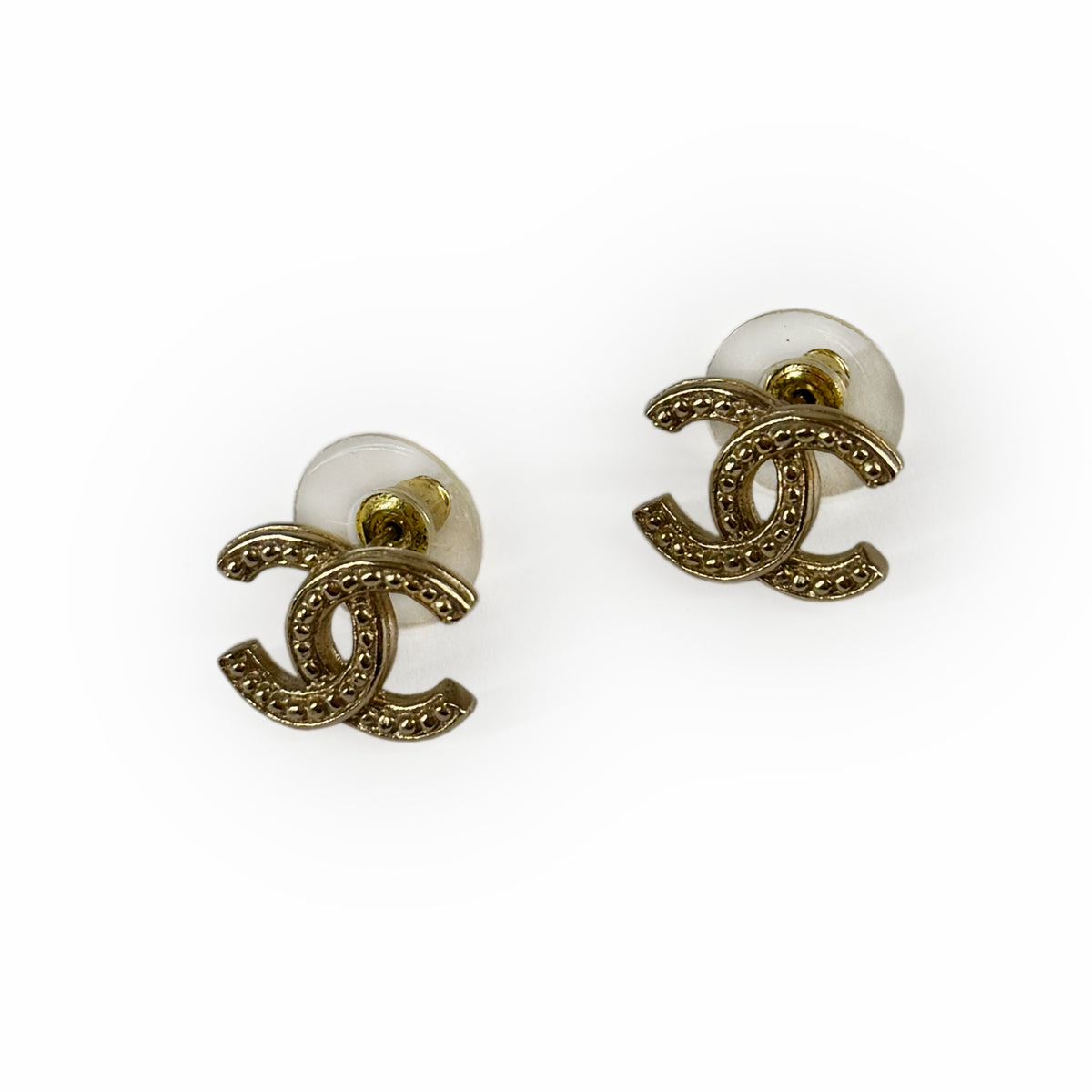 Gold-tone Chanel interlocking CC stud earrings with crystal embellishments, curated Pre-loved Luxury by Myluxe in Helsinki.