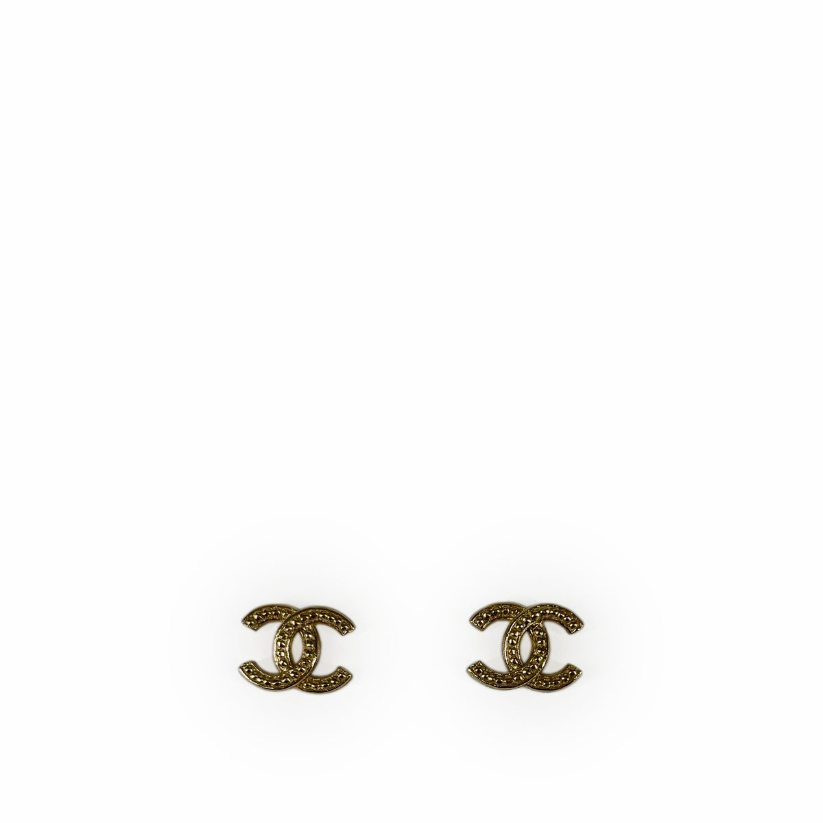 Gold-tone Chanel interlocking CC logo stud earrings, curated Pre-loved Luxury by Myluxe in Helsinki.
