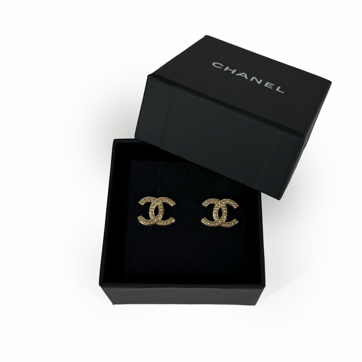 Chanel gold-tone interlocking CC logo stud earrings with crystal embellishments, curated Pre-loved Luxury by Myluxe in Helsinki.